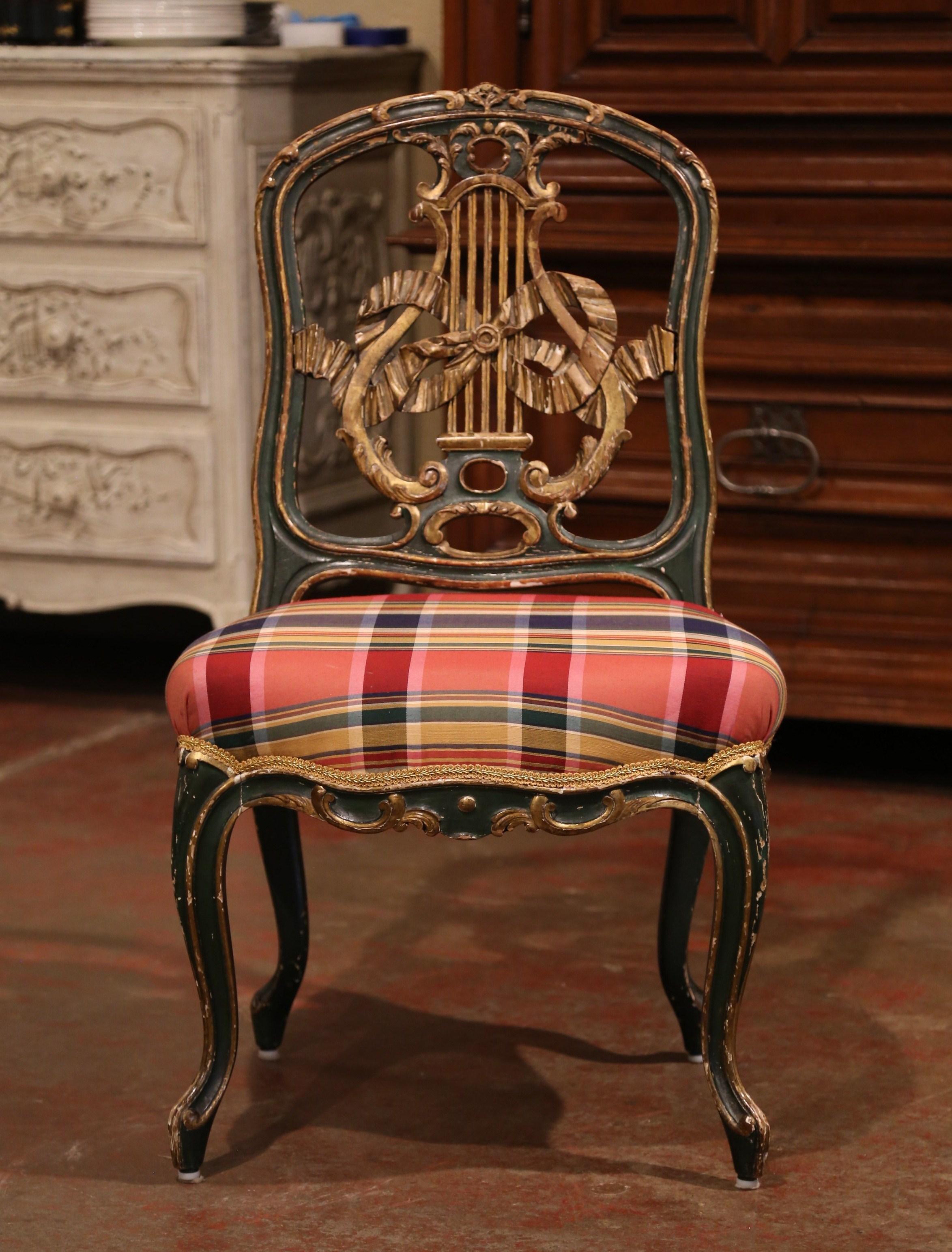 Decorate a master bathroom with this elegant antique chair; crafted in France circa 1870, the decorative chair stands on cabriole legs over a scalloped apron. The piece features wonderful carvings on the back including lyre and traditional ribbon