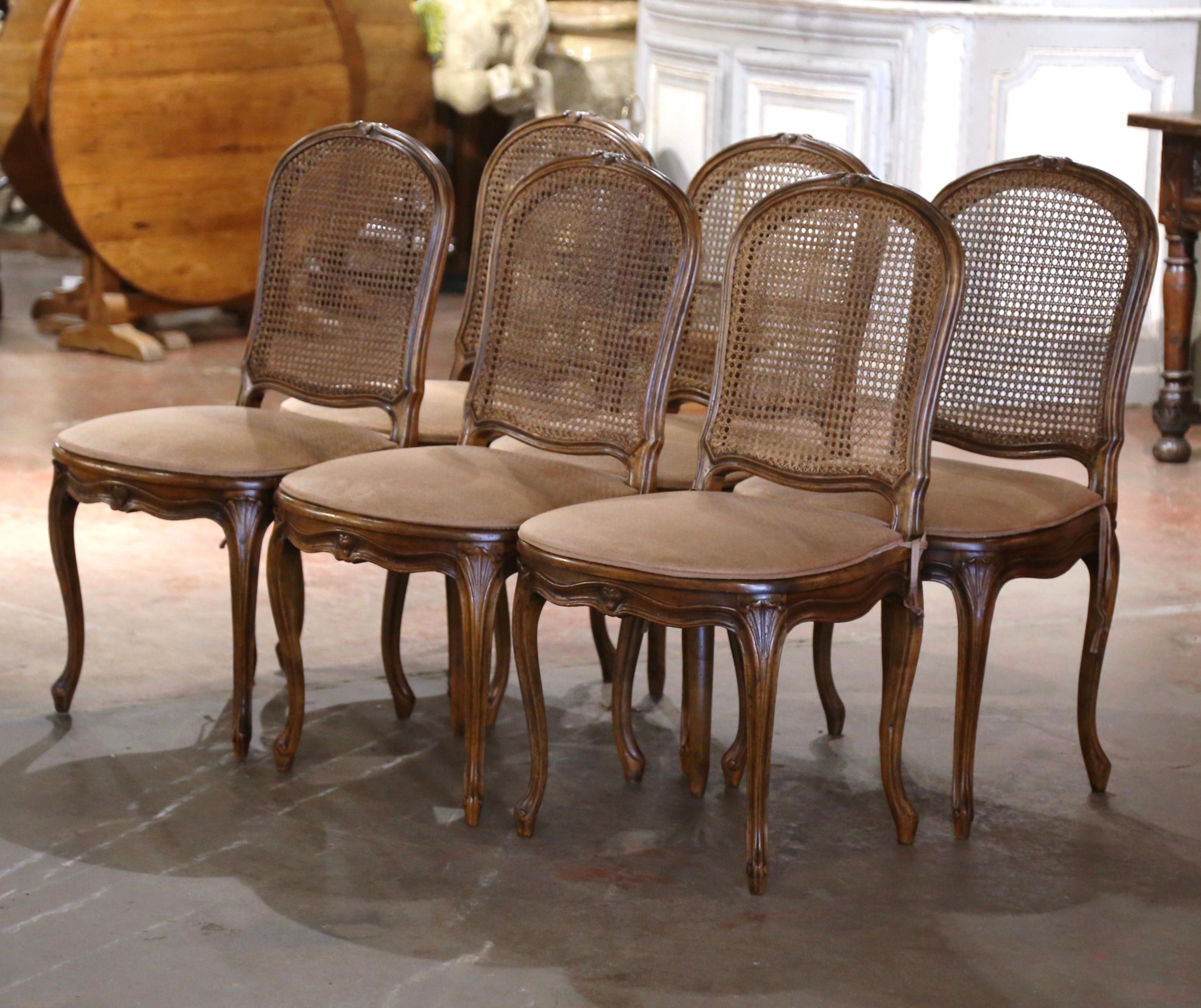 Decorate a dining table with this elegant suite of antique side chairs. Crafted in France circa 1880, and built of walnut, each chair stands on cabriole legs decorated with acanthus leaves at the shoulder, and ending with escargot feet. The chair