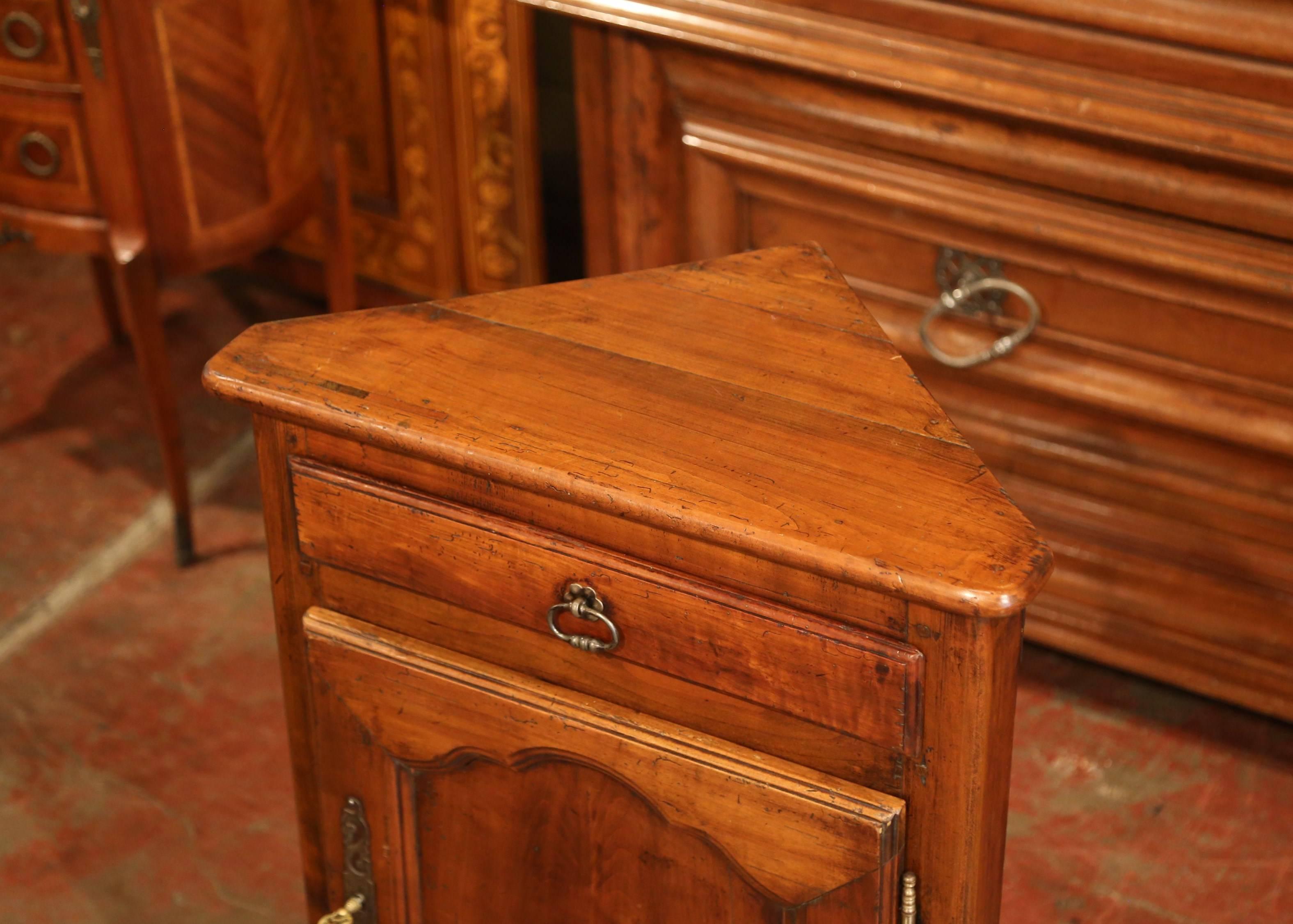 This small and elegant fruitwood corner piece, or 
