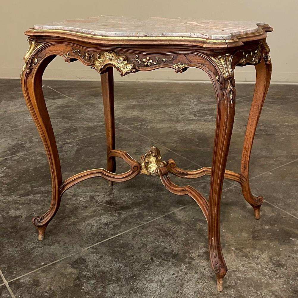 19th Century French Louis XV Carved Walnut Marble Top End Table represents the epitome of the style! Gracefully contoured top in the classic 