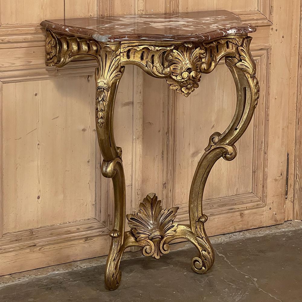 19th Century French Louis XV giltwood marble top console is an amazing rendition of the style that glorifies the beauty of nature, emphasizing shell floral and foliate forms to an amazing degree of artistry! The bowfront framework connects to the