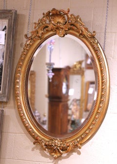 19th Century French Louis XV Giltwood Oval Wall Mirror with Beveled Glass
