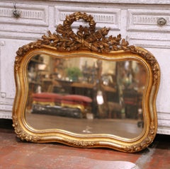19th Century French Louis XV Giltwood Wall Mirror with Floral Crest