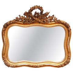 19th Century French Louis XV Giltwood Wall Mirror with Floral Crest