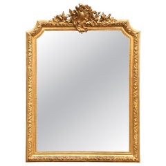 19th Century French Louis XV Giltwood Wall Mirror with Floral Crest