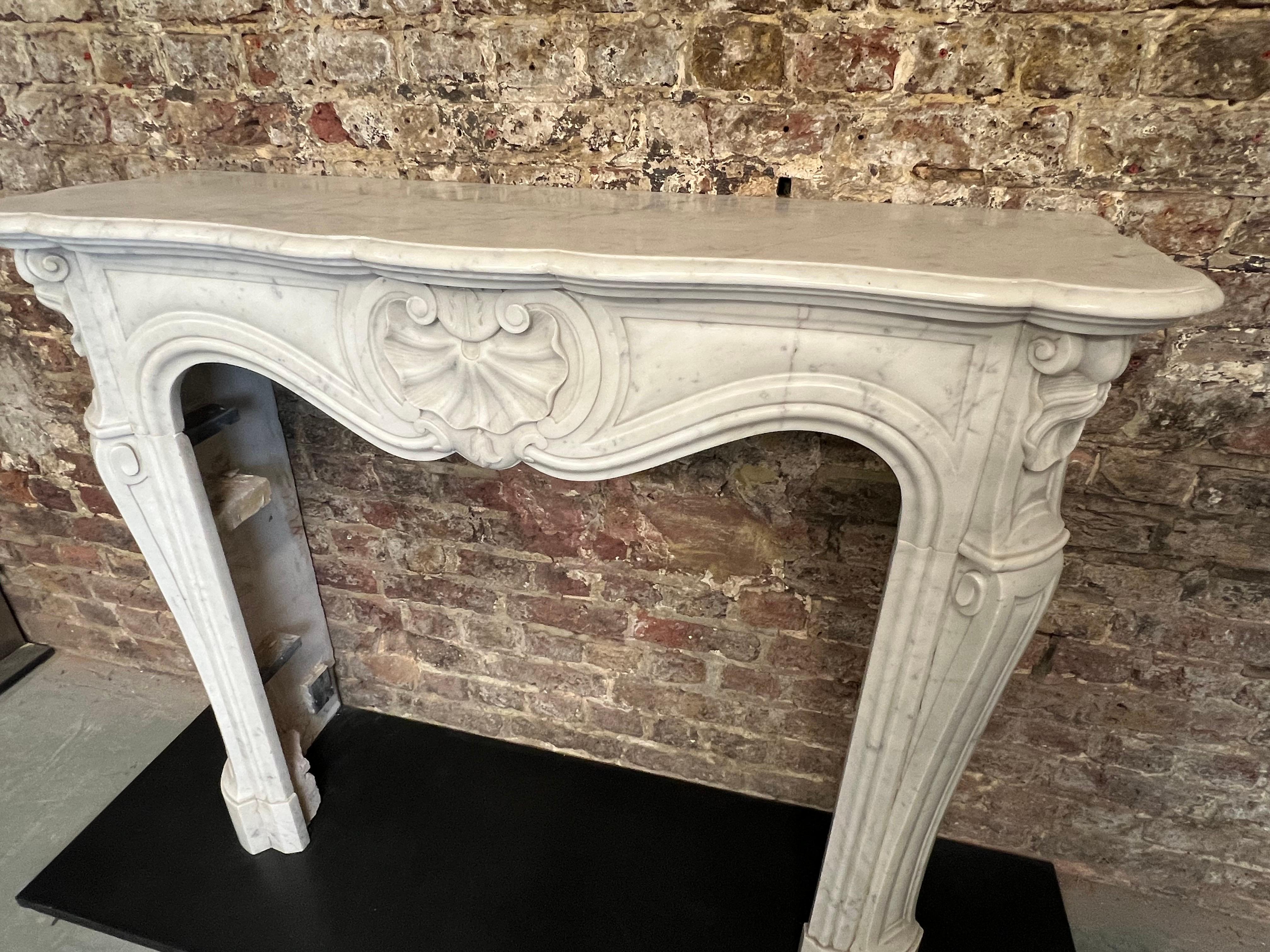 Hand-Carved 19th Century French Louis XV Marble Fireplace For Sale