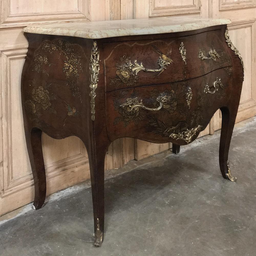 19th century French Louis XV marble-top bombe commode was made by Bois de Rose of Paris, and features the rich luxurious appearance of exotic imported woods lavished with hand-painted birds, flowers and foliage all applied to the curvaceous bombe