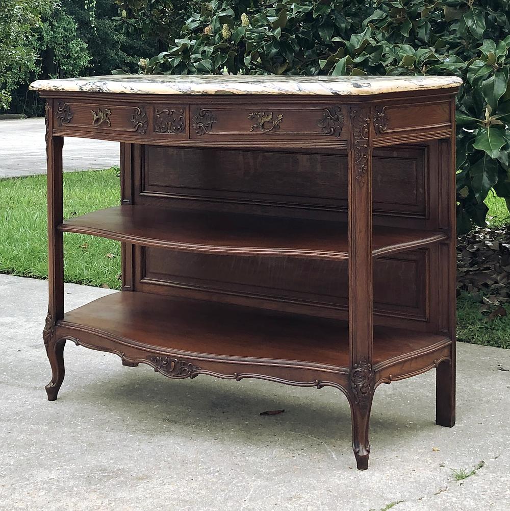 19th century French Louis XV marble top essert buffet is a truly elegant way to serve and display in style! hand-crafted from select finely grained oak, it features serpentine sides that are open allowing one to view what is on display on the lower