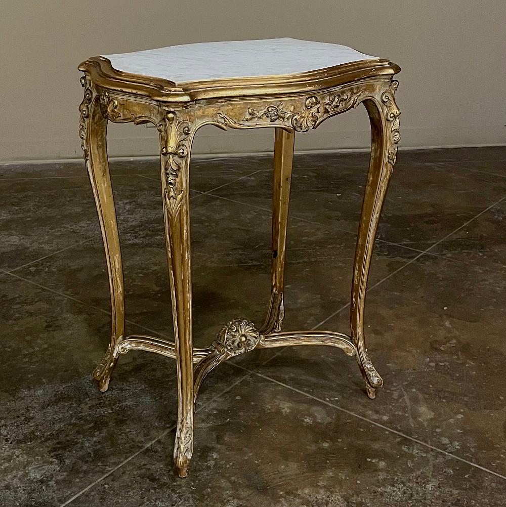 19th Century French Louis XV marble top giltwood end table is a prime example of fine French furniture craftsmanship! Sculpted from fine fruitwood, it features the graceful, naturalistic form of the style with the only straight line being the