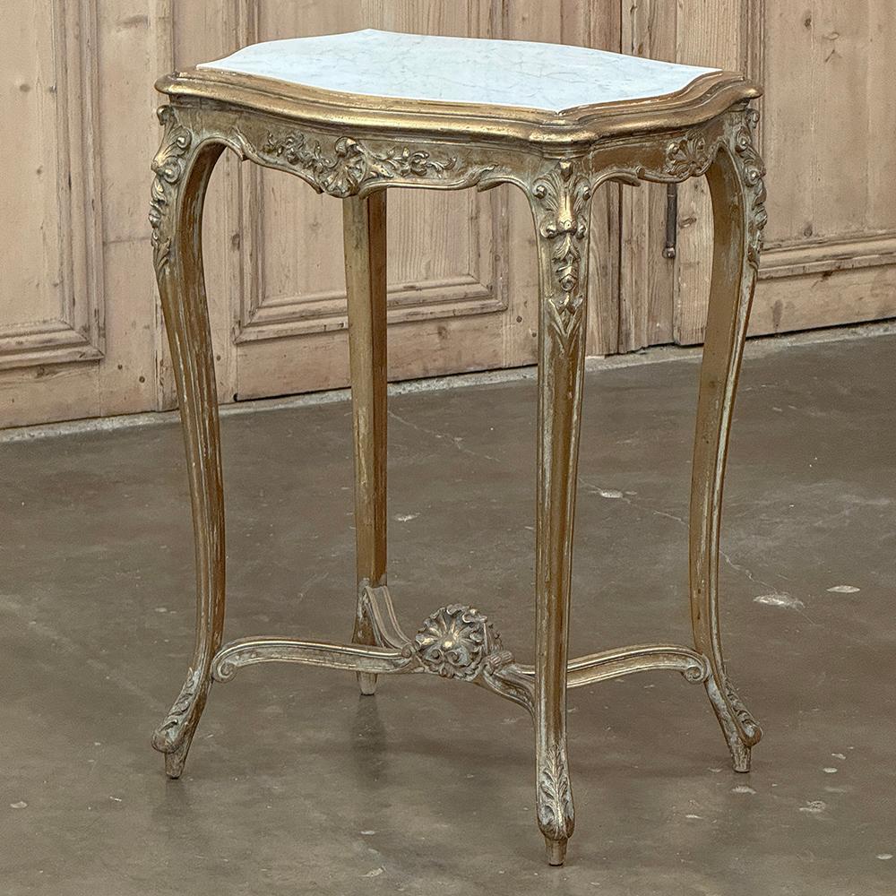 19th Century French Louis XV Marble Top Giltwood End Table is a prime example of fine French furniture craftsmanship!  Sculpted from fine fruitwood, it features the graceful, naturalistic form of the style with the only straight line being the
