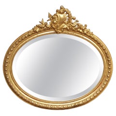 19th Century French Louis XV Oval Giltwood Wall Beveled Mirror with Crest