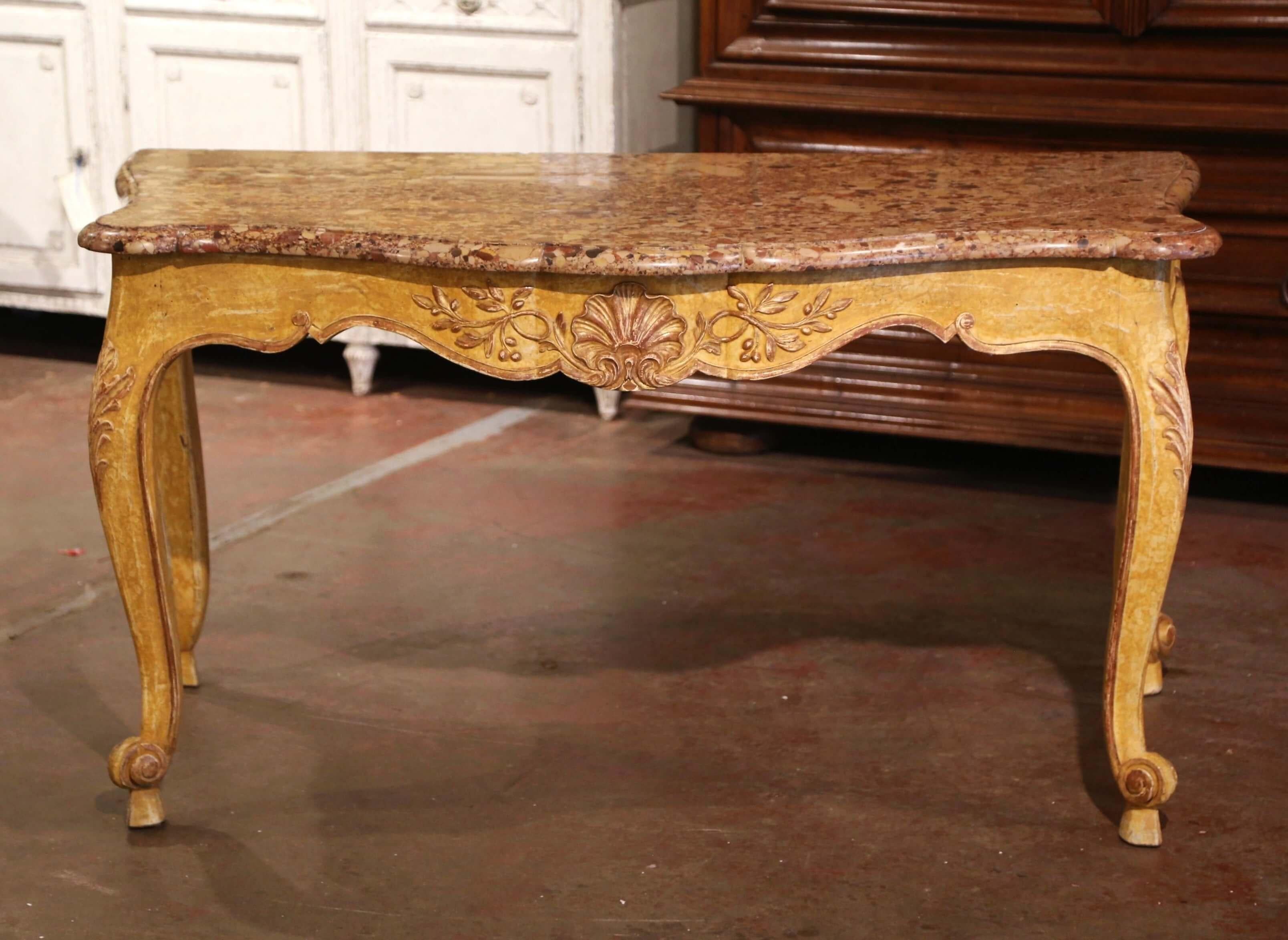 Decorate an entryway or a living room with this elegant and colorful antique console table. Created in Provence, Southern France circa 1880, the large table stands on cabriole legs decorated with acanthus leaves at the shoulder, and ending with