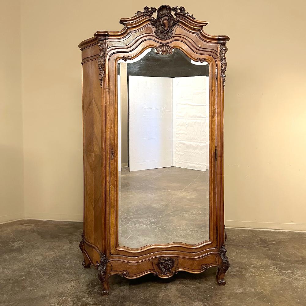 19th Century French Louis XV Serpentine Rosewood Armoire is a work of the furniture crafter's art!  The design features only one flat surface showing, and that is the full length beveled dressing mirror mounted on the door.  All other facets of the