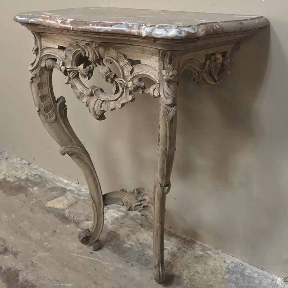 19th Century French Louis XV Marble Top Stripped Console was sculpted by a talented artist, indeed! Incredibly detailed pierce-carving is purely the result of a gifted sculptor who molded the wood into the elaborate, complex yet naturalistic shapes