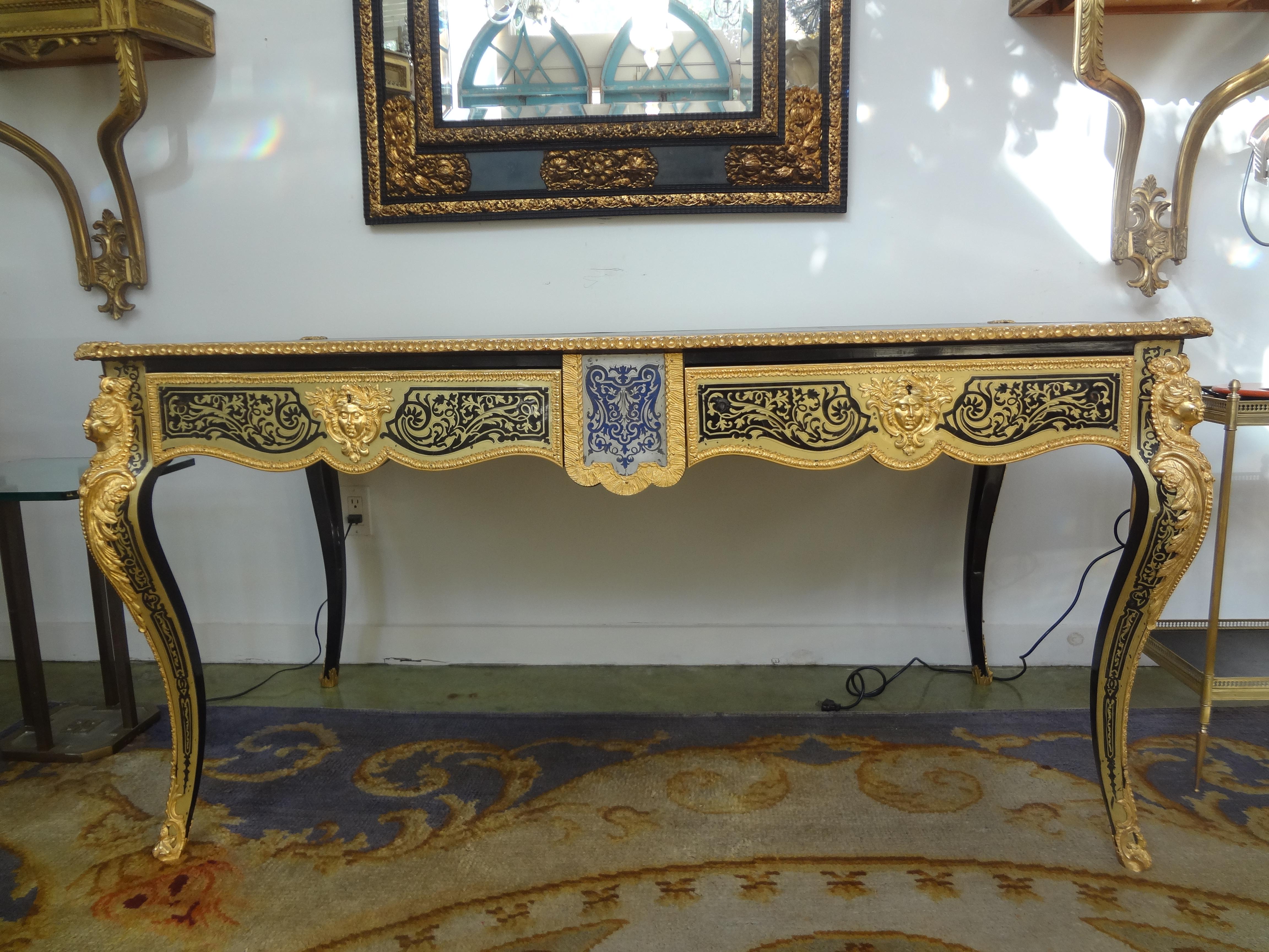 19th Century French Louis XV Style Boulle Bureau Plat.
Our outstanding antique French Louis XV style Boulle inspired bureau plat, desk or writing table was expertly crafted in the mid 19th century with beautifully detailed inlaid brass and fine