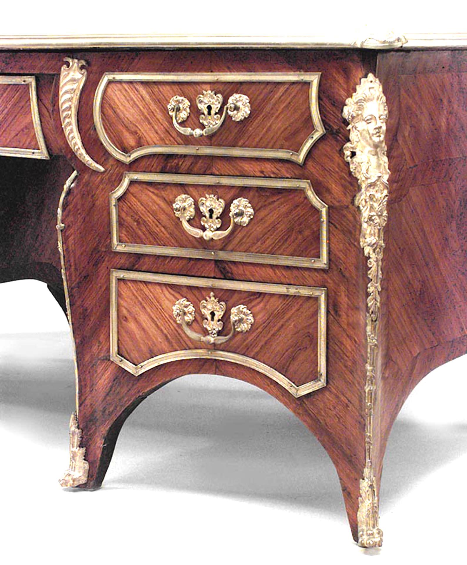 French Louis XV style (19th Century) kingwood and bronze trimmed kneehole desk with green leather top.
