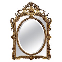 Specchio francese del XIX secolo in stile Luigi XV intagliato e in legno dorato