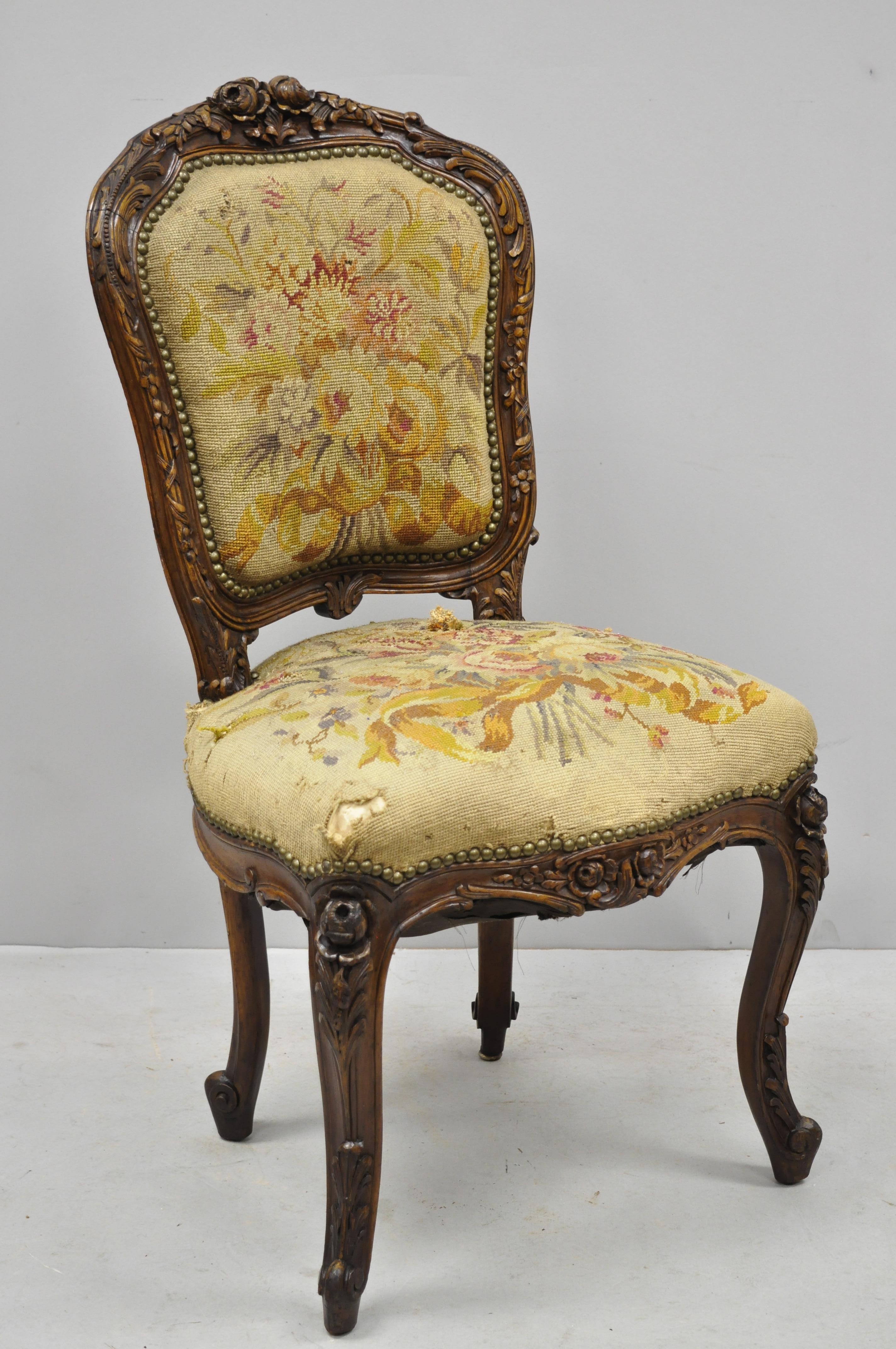 19th century French Louis XV style carved walnut needlepoint side chair. Item features finely carved details throughout, floral carvings to top rail and legs, needlepoint upholstery, cabriole legs, very nice antique item, circa late 19th century.