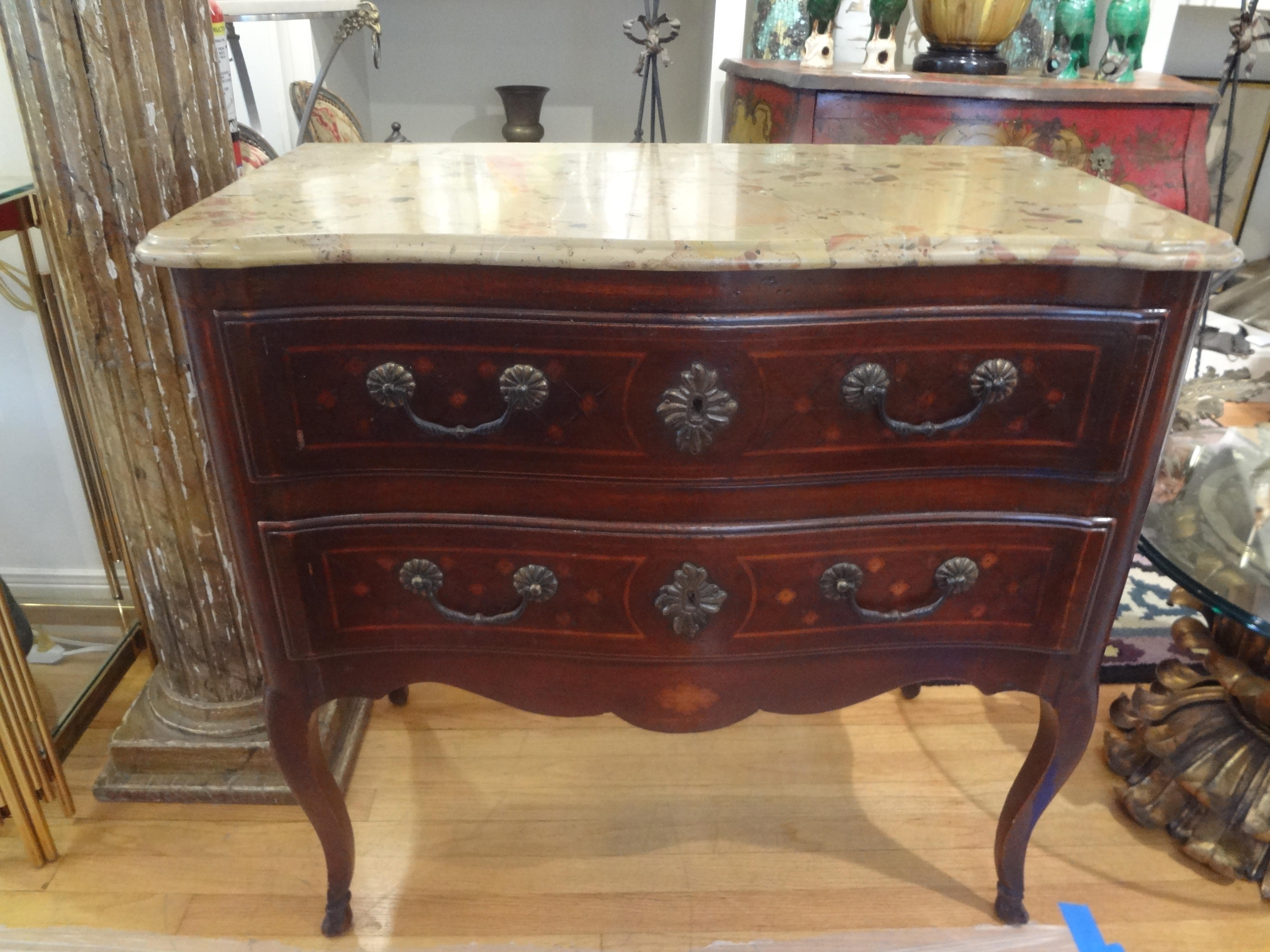 19th century French Louis XV style commode.
Stunning 19th century French Louis XV style 2 drawer commode with hoof feet, bronze hardware and a Breche d’Alp marble top. This French commode or chest is the perfect size for an entrance hall, living