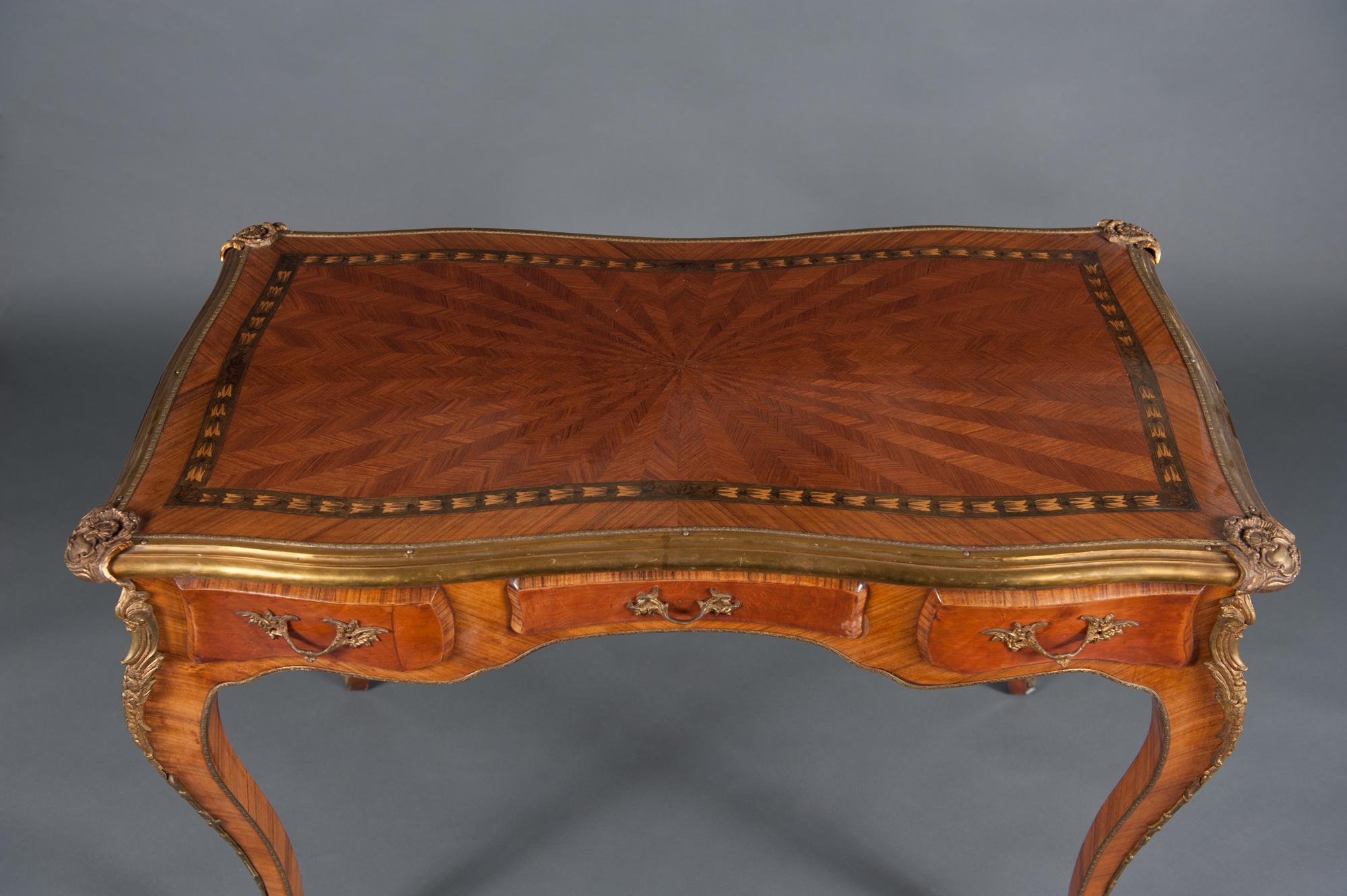 A very fine and well-proportioned 19th century French lady's desk, the case veneered with marquetry decoration and embellished with finely cast and finished gilt bronze mounts. The desk is fitted with three drawers to the frieze and three ‘faux’