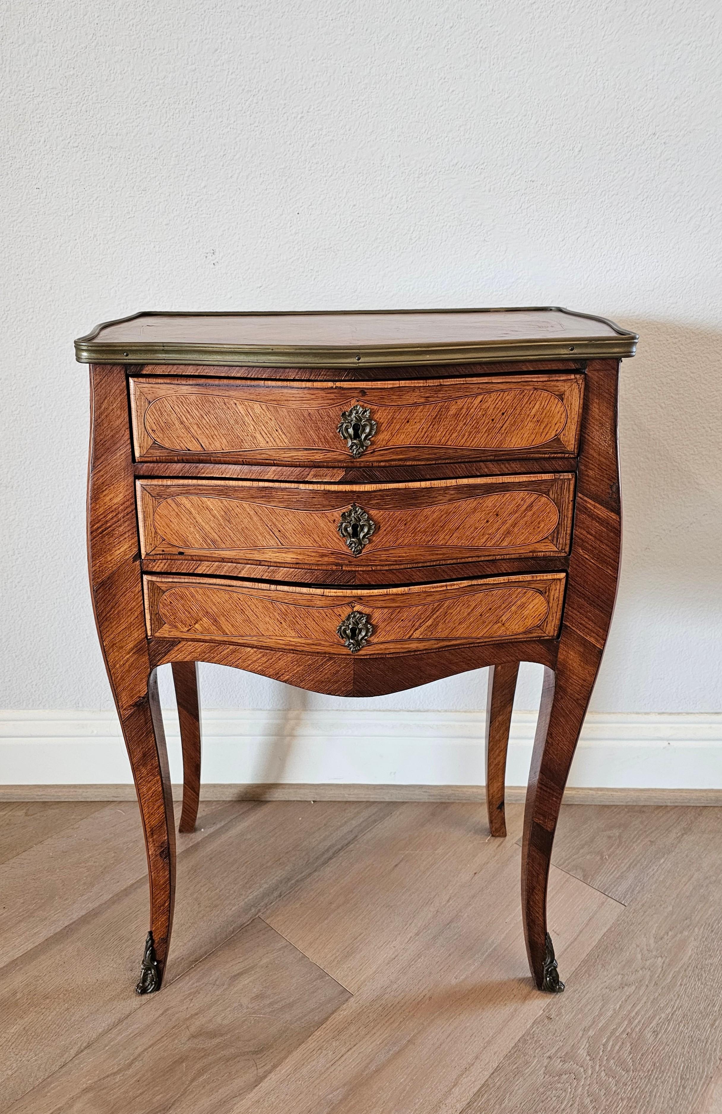 A charming fine quality antique French Louis 15th style matched-veneer parquetry chest of drawers nightstand - end table.

19th Century, France, displaying the refined elegance and sophistication that King Louis Fifteenth furniture is known for,