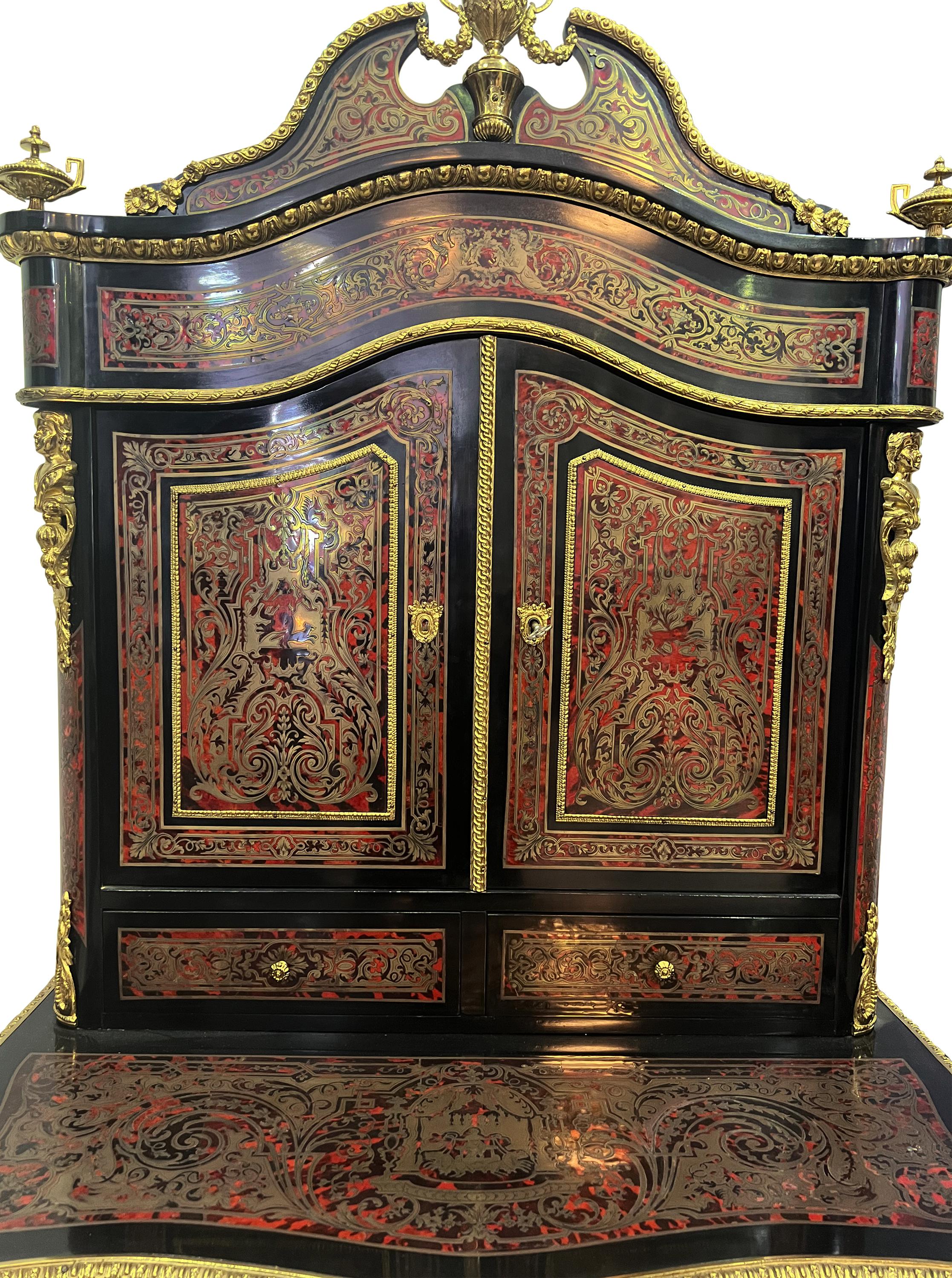 19th Century French Louis XV Style Ormolu Mounted Boulle Secretary Desk
Having a writing section along with a two door commode for mail secretary needs.
Mounted with ormolu bronze mounts and heavily decorated with inlaid brass wire throughout. The