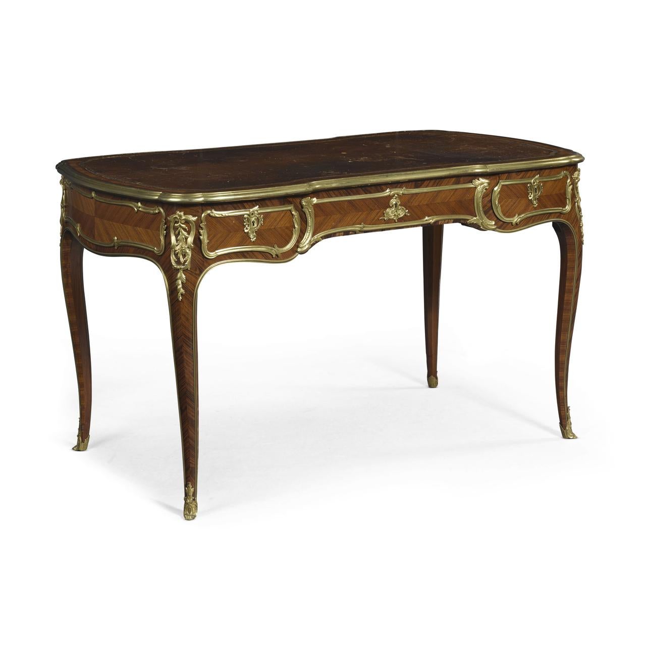 A fabulous French Louis XV style late 19th century gilt bronze mounted tulipwood and kingwood bureau plat - desk