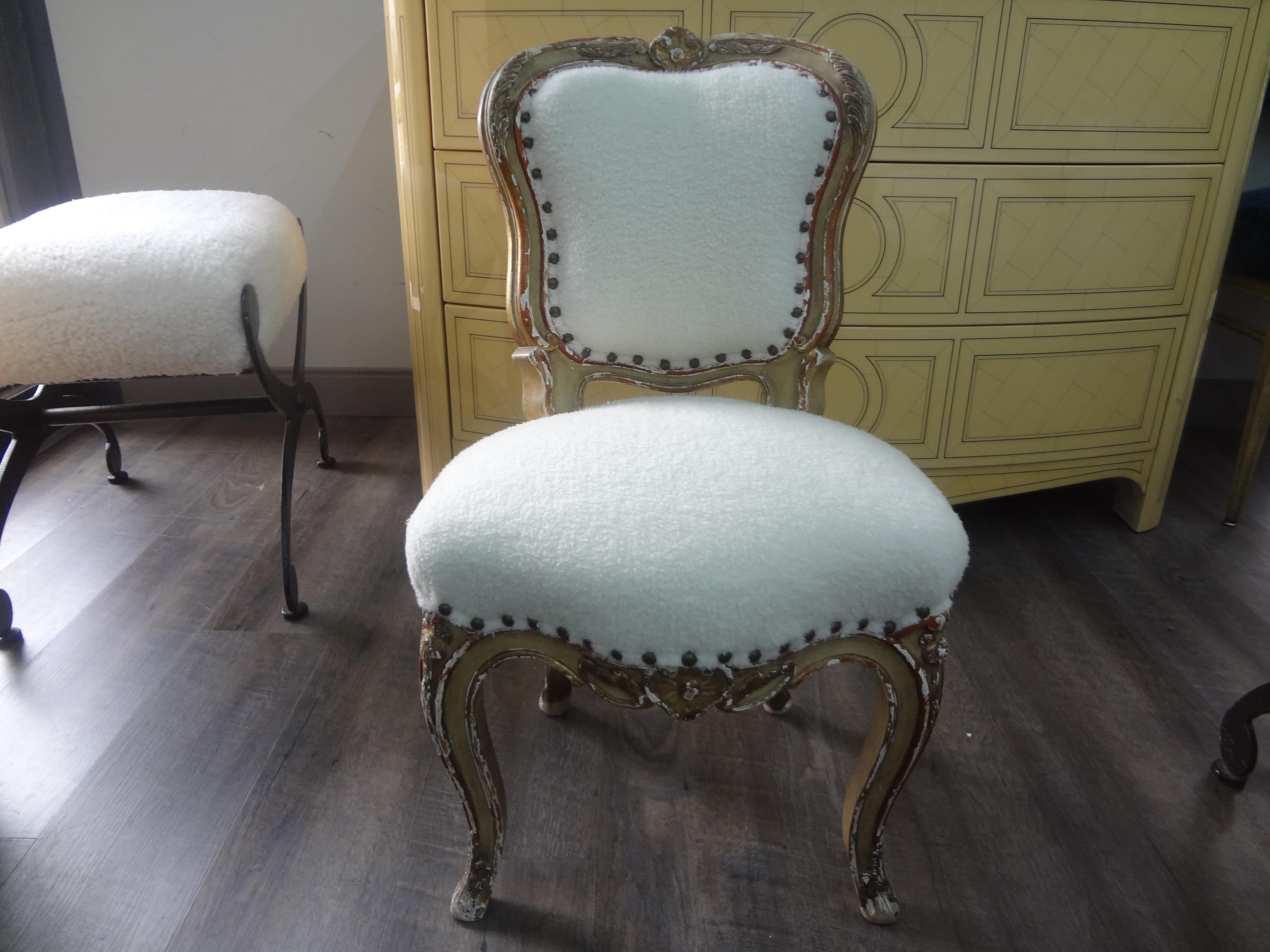 19th century French Louis XV style painted and parcel gilt children's chair.
This stunning antique French Louis XV style painted and parcel gilt children's chair has been professionally upholstered in white mohair fabric with spaced brass nail head