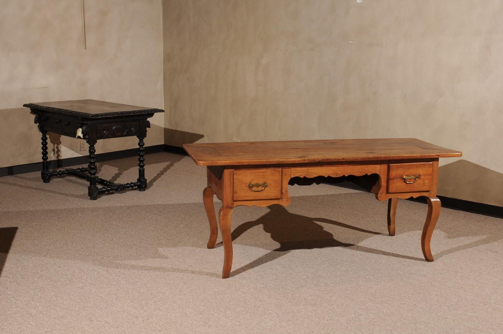 Provincial Louis XV style fruitwood desk with two (2) drawers, shaped apron, and cabriole legs, 19th century, France.