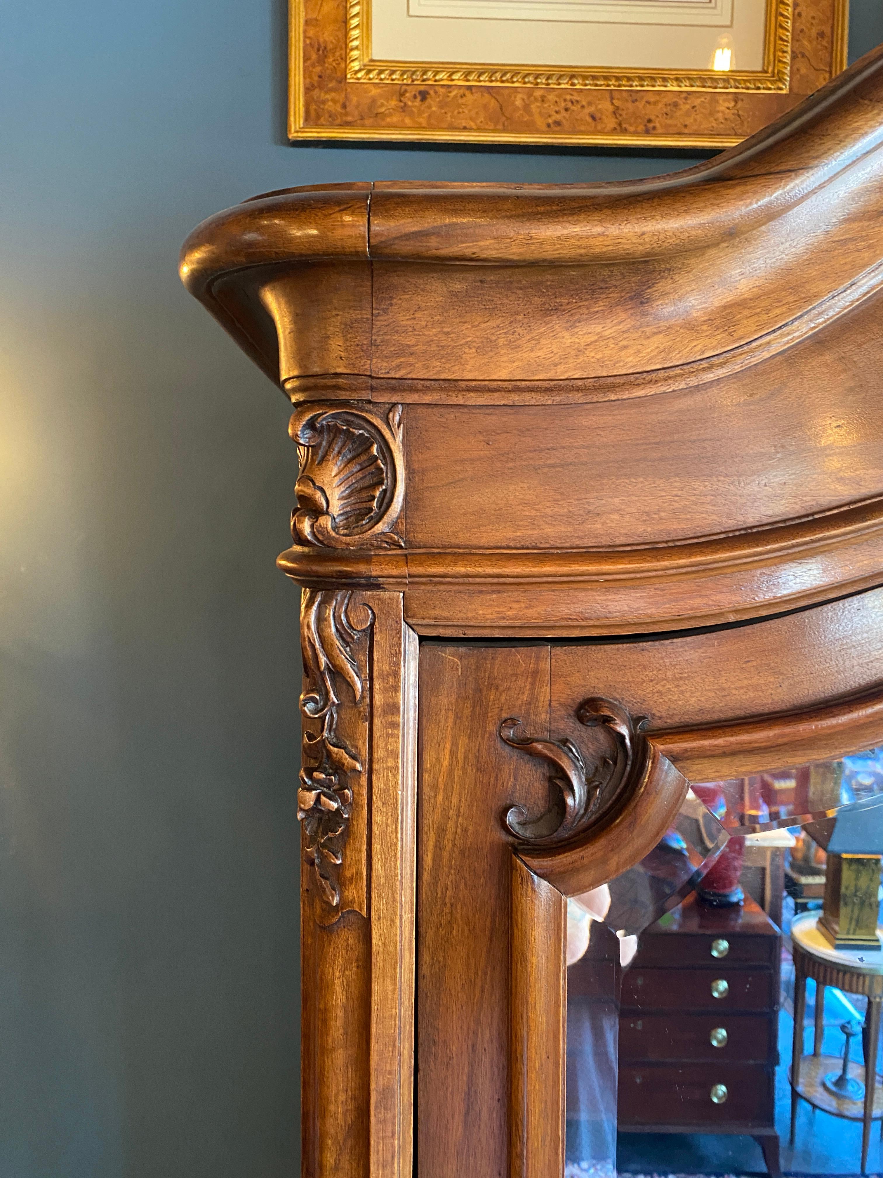 French Louis XV style walnut armoire, three part cabinet resting upon relief carved base with cabriolet legs. Interior Birdseye maple drawers and oak shelving. Large 1