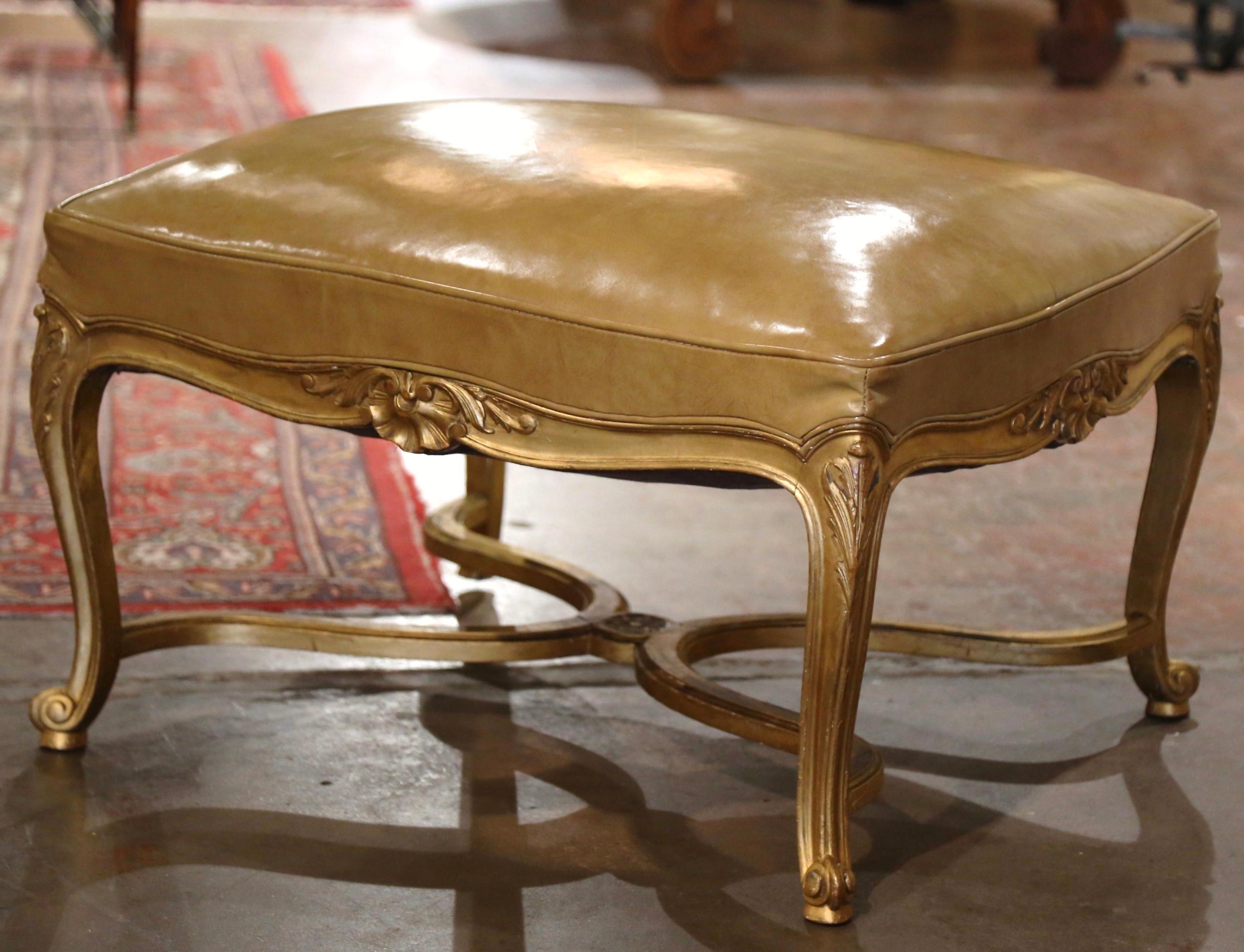 Place this elegant, antique gilt wood bench in your den or living room for extra seating. Crafted in Paris, France, circa 1890, the large traditional stool stands on cabriole legs decorated with acanthus leaf motifs at the shoulders ending with