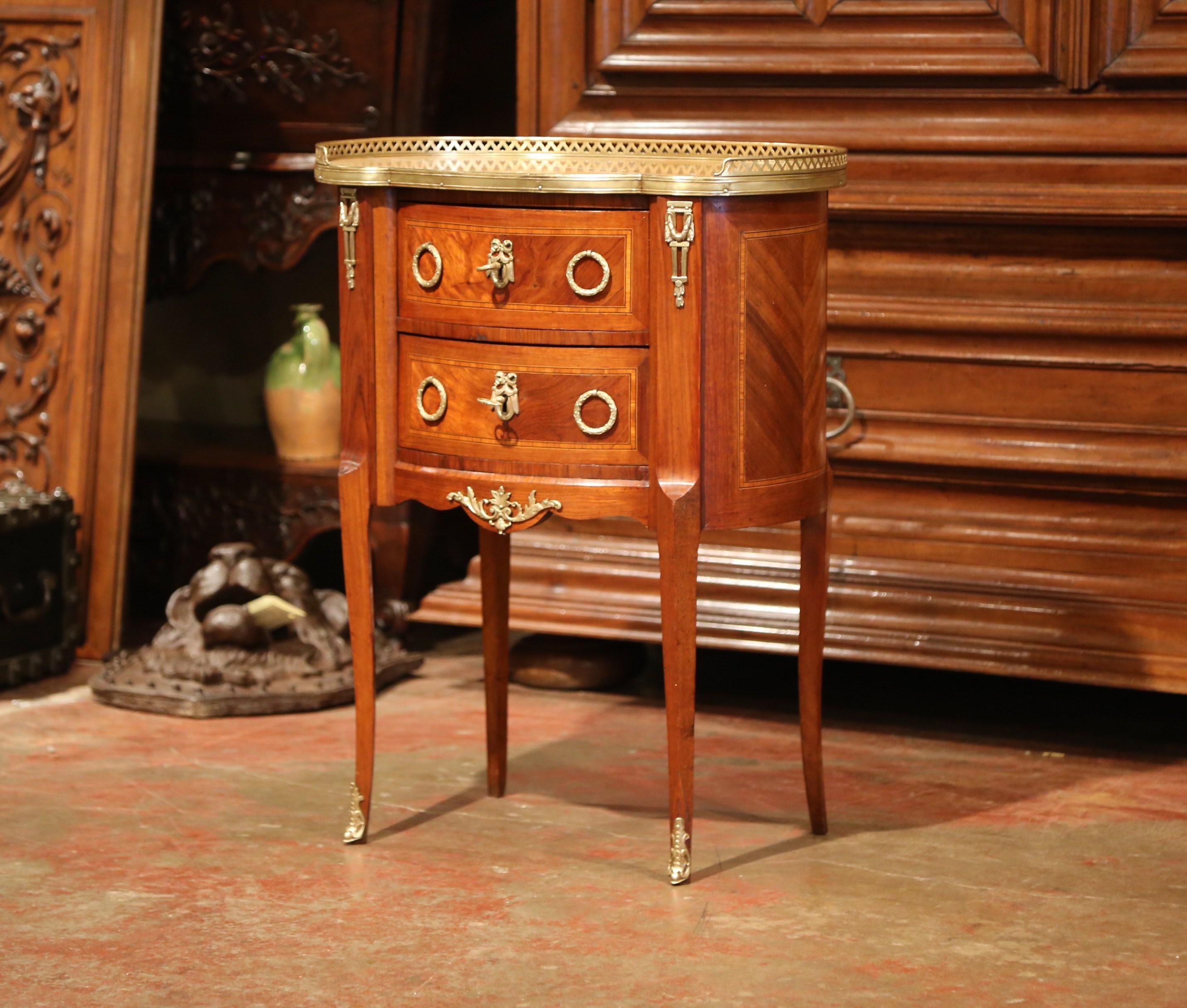 This elegant, kidney-shaped fruitwood commode is a versatile side cabinet for any room. Crafted in Paris, France, circa 1880, this sophisticated, detailed piece could be used as a bedside table, a side table beside an armchair, or as a small storage