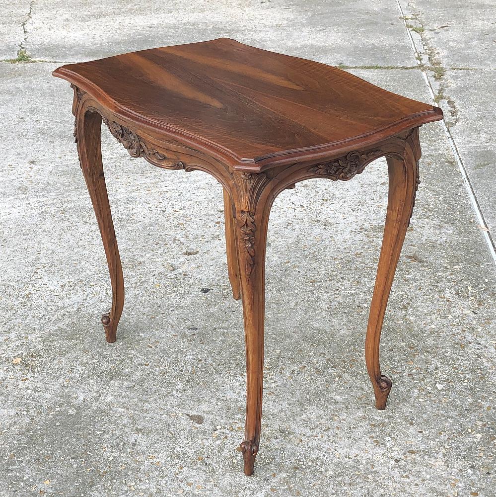 19th century French Louis XV walnut end table is a tailored expression of the style, with graceful, subtle cabriole legs, and a contoured apron with a minimum of carved accentuation,

circa 1890s

Measures: 27.5 H x 31 W x 21.5 D.