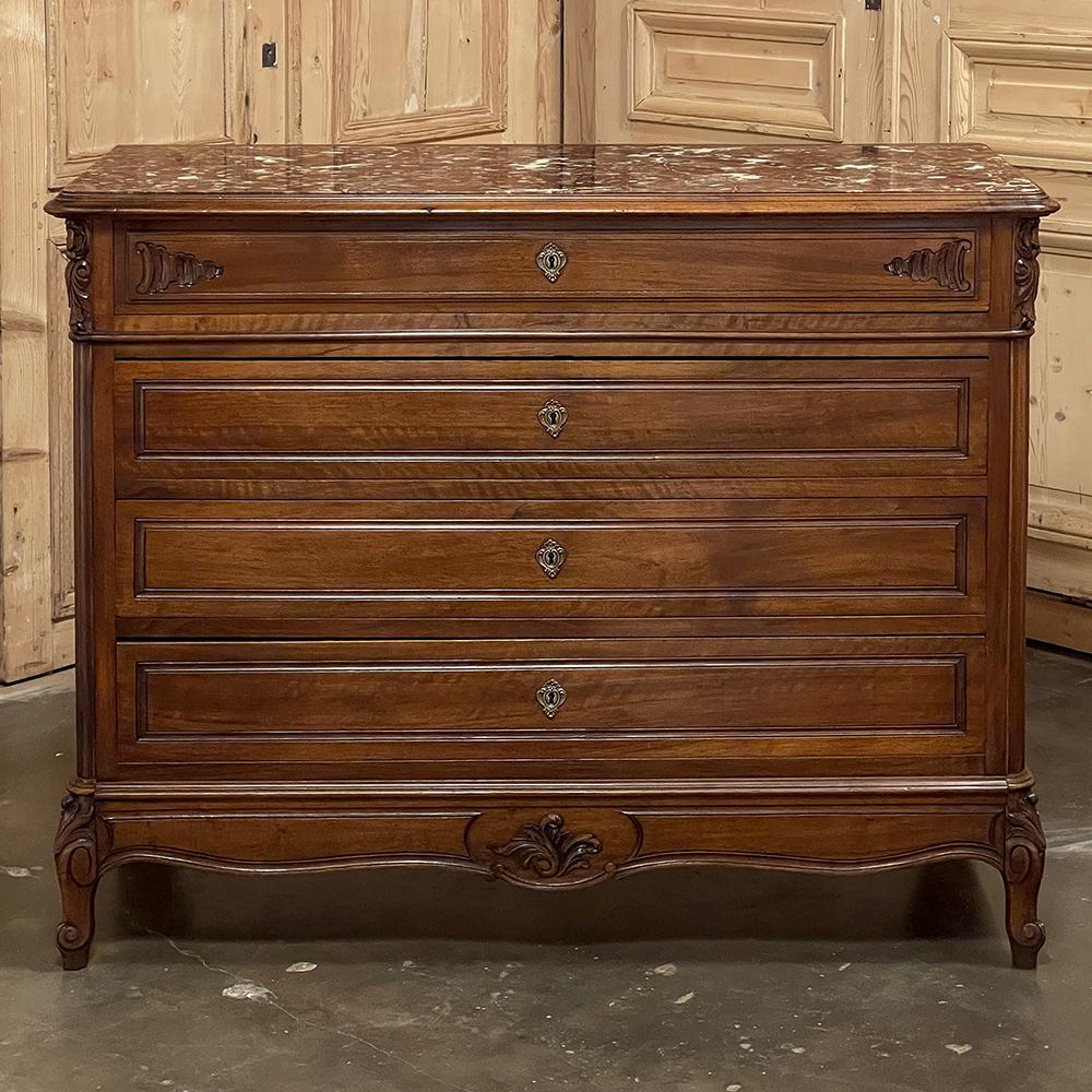 19th Century French Louis XV walnut marble top commode is a classic example of pure, understated elegance! Hand-crafted from sumptuous select French walnut, it features a subtly scrolled apron all around below, supported by scrolled legs the front