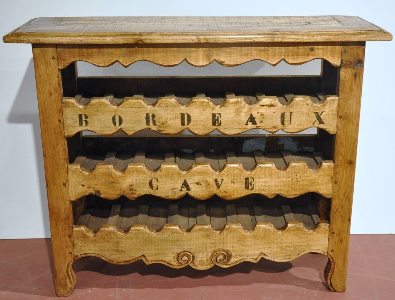 Decorate your wine cellar, breakfast room or kitchen with this beautiful, antique cabinet from the Southwest region of France. The unique buffet with top surface space features three shelves with scalloped edges which could hold up to two cases of
