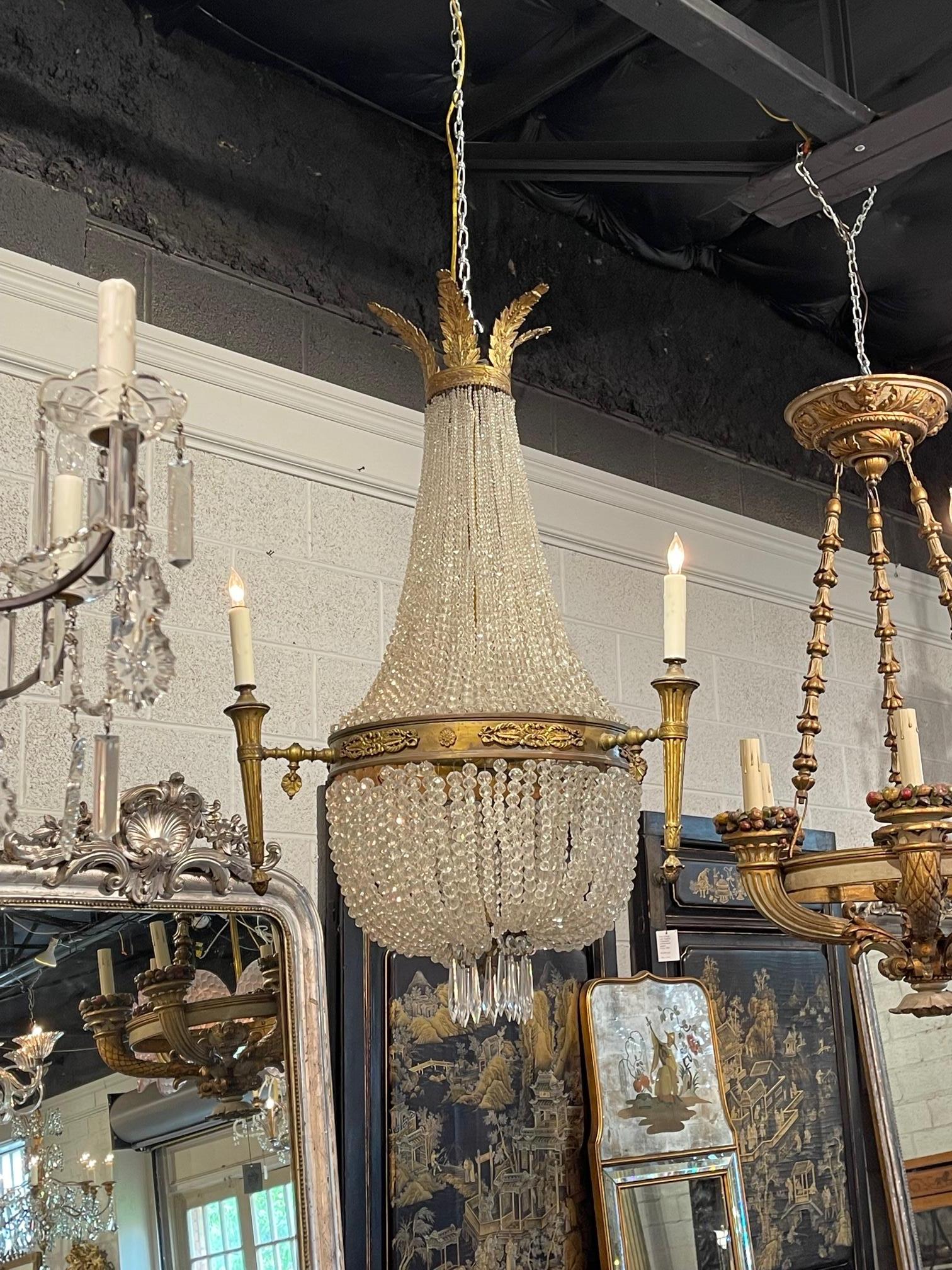 Exceptional 19th century French Louis XVI style bronze and crystal chandelier with 6 lights. This fixture has a beautiful basket shape and is loaded with crystals. Very fine bronze elements as well. Super elegant!