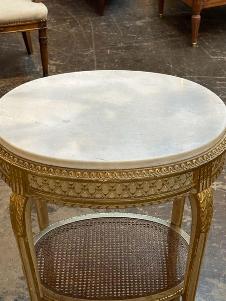 Very fine 19th century French Louis XVI cared and gilded side table. Beautiful intricate carving and topped with an inlay of cararra marble. Gorgeous!