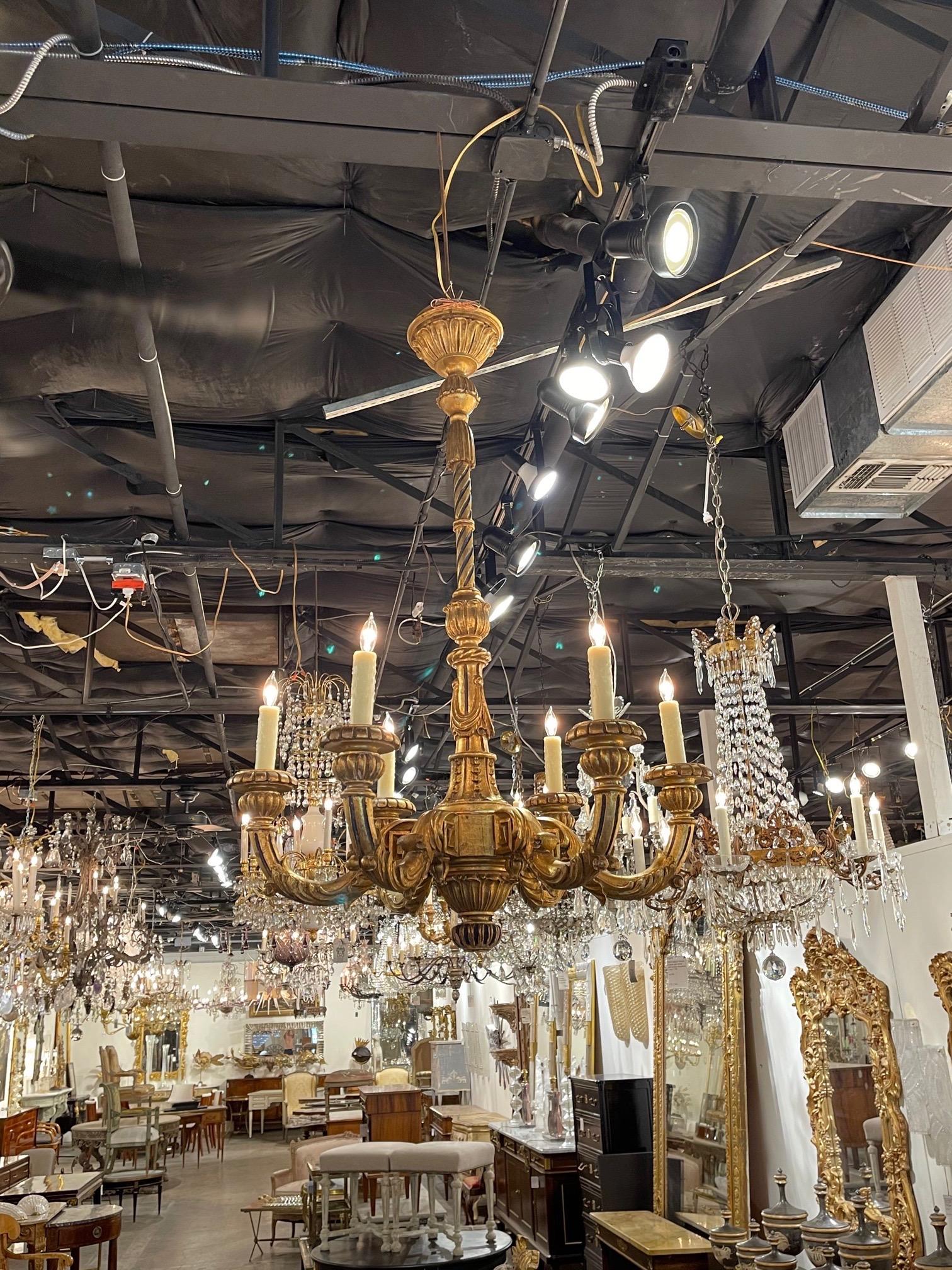 Superb 19th century French Louis XVI style carved and giltwood chandelier with 6 lights. Exceptional carvings on this elegant piece! Makes an impressive statement!