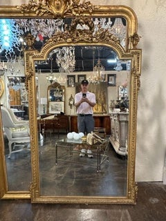 Miroir Louis XVI en bois sculpté et doré du 19ème siècle