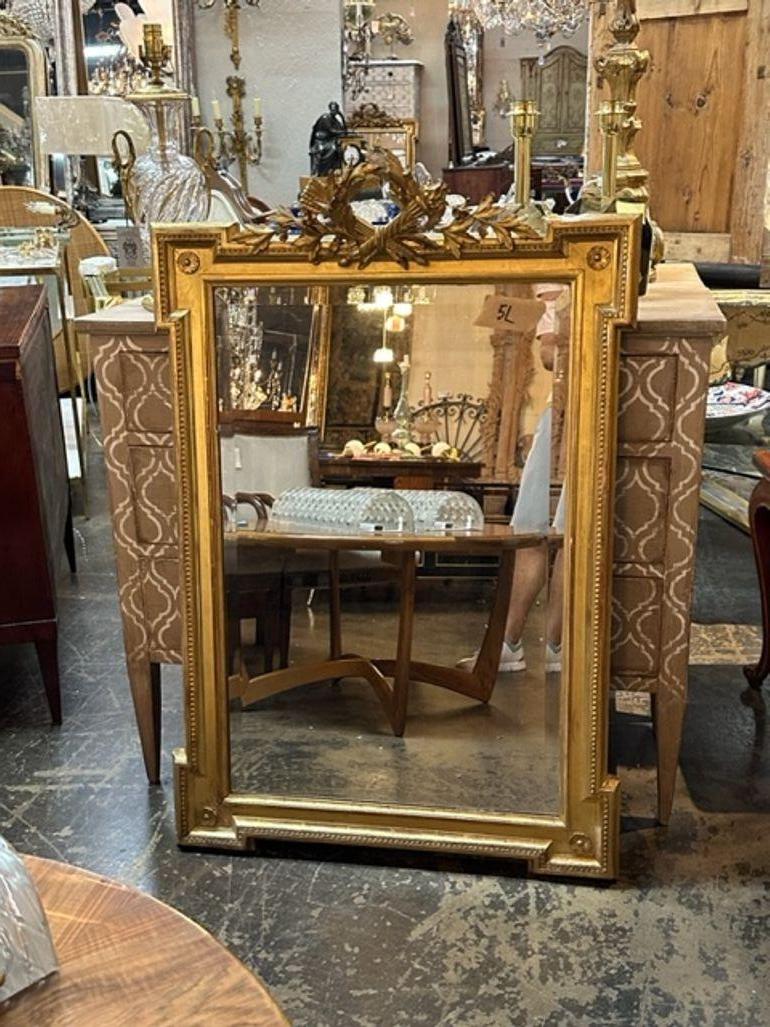 Miroir Louis XVI en bois sculpté et doré du 19ème siècle en vente 1