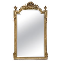 Miroir Louis XVI en bois sculpté et doré du 19ème siècle