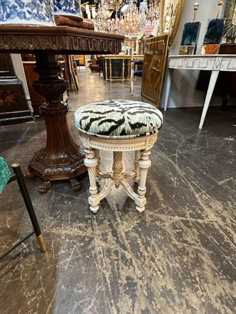 Very nice 19th century French Louis XVI carved and painted stool. Upholstered in a beautiful velvet fabric with a tiger pattern. Lovely!