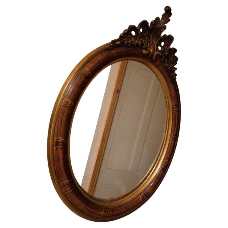 19th century French Louis XVI carved gilt wood oval wall mirror. In very good condition. It could be a lovely gift.
Please refer to the pictures for details, sizes and condition as it makes part of the description
Color: Brown 
Frame material: