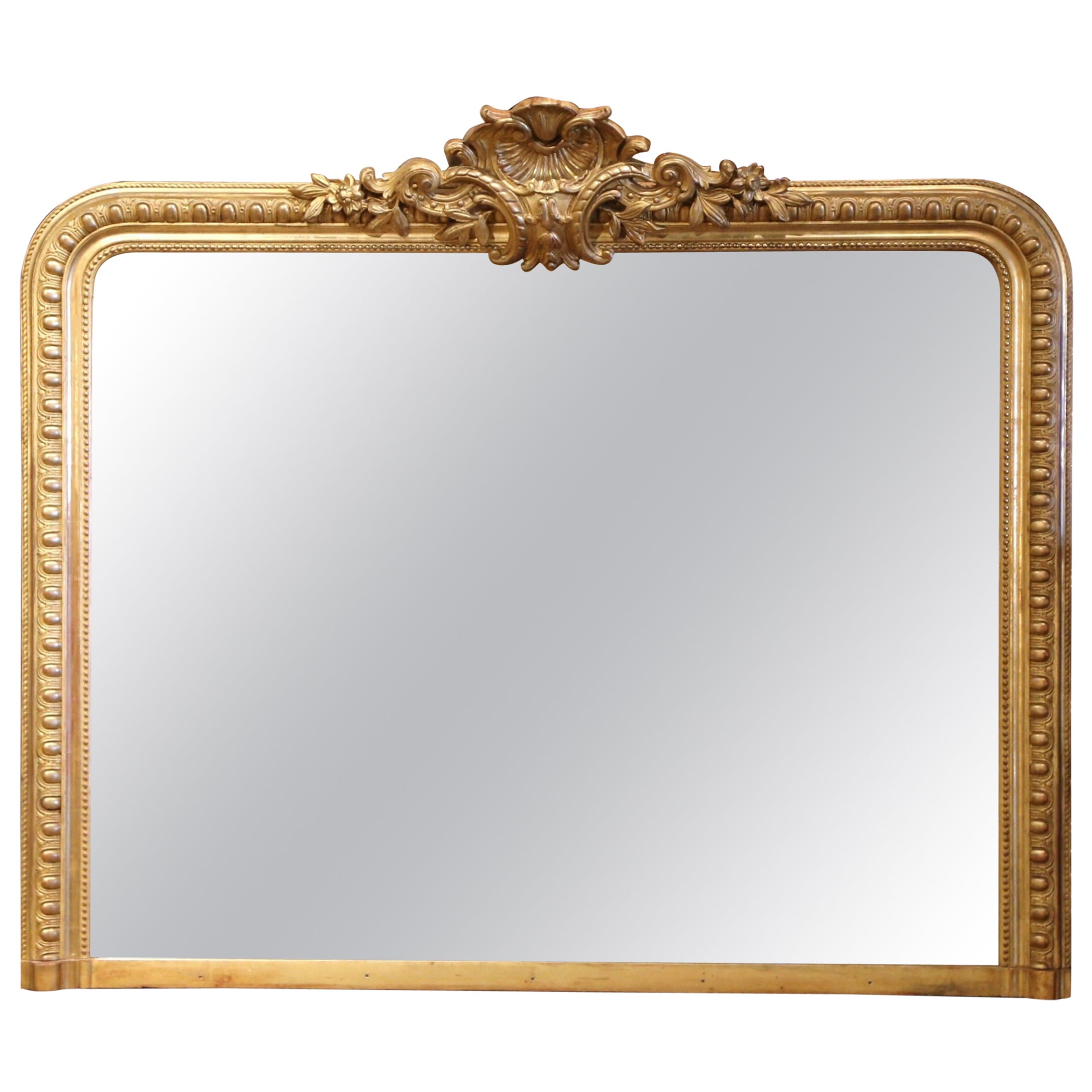 19th Century French Louis XVI Carved Giltwood Mantel Mirror with Shell Motif