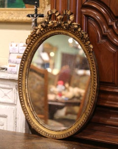 19th Century French Louis XVI Carved Giltwood Oval Wall Mirror with Ribbon Bow