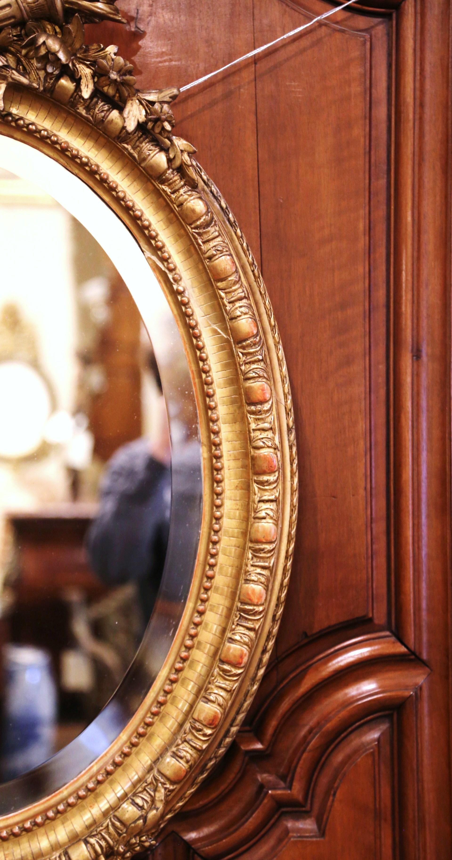 19th Century French Louis XVI Carved Giltwood Oval Wall Mirror with Torch Motif 5