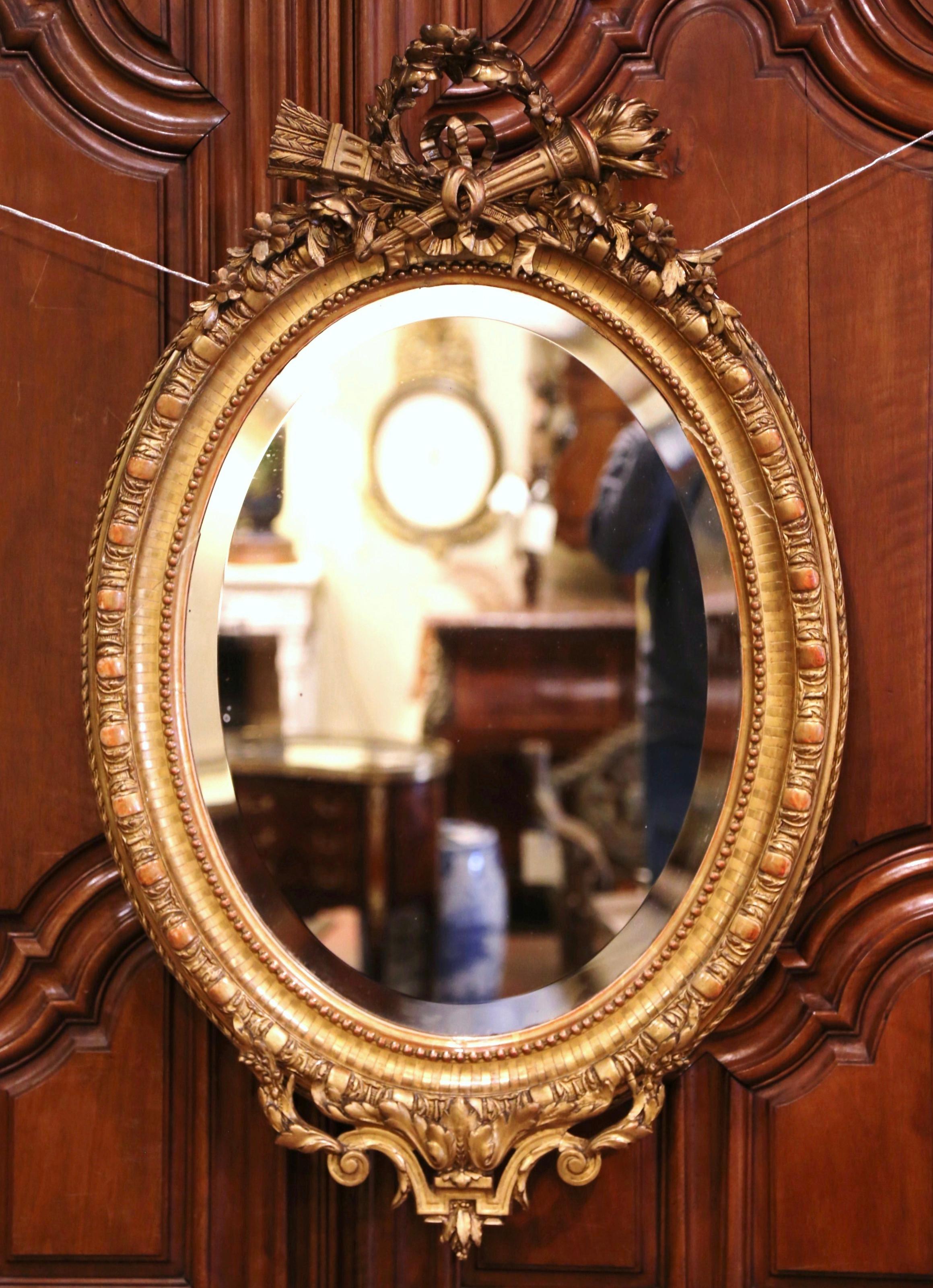 Hand-Carved 19th Century French Louis XVI Carved Giltwood Oval Wall Mirror with Torch Motif