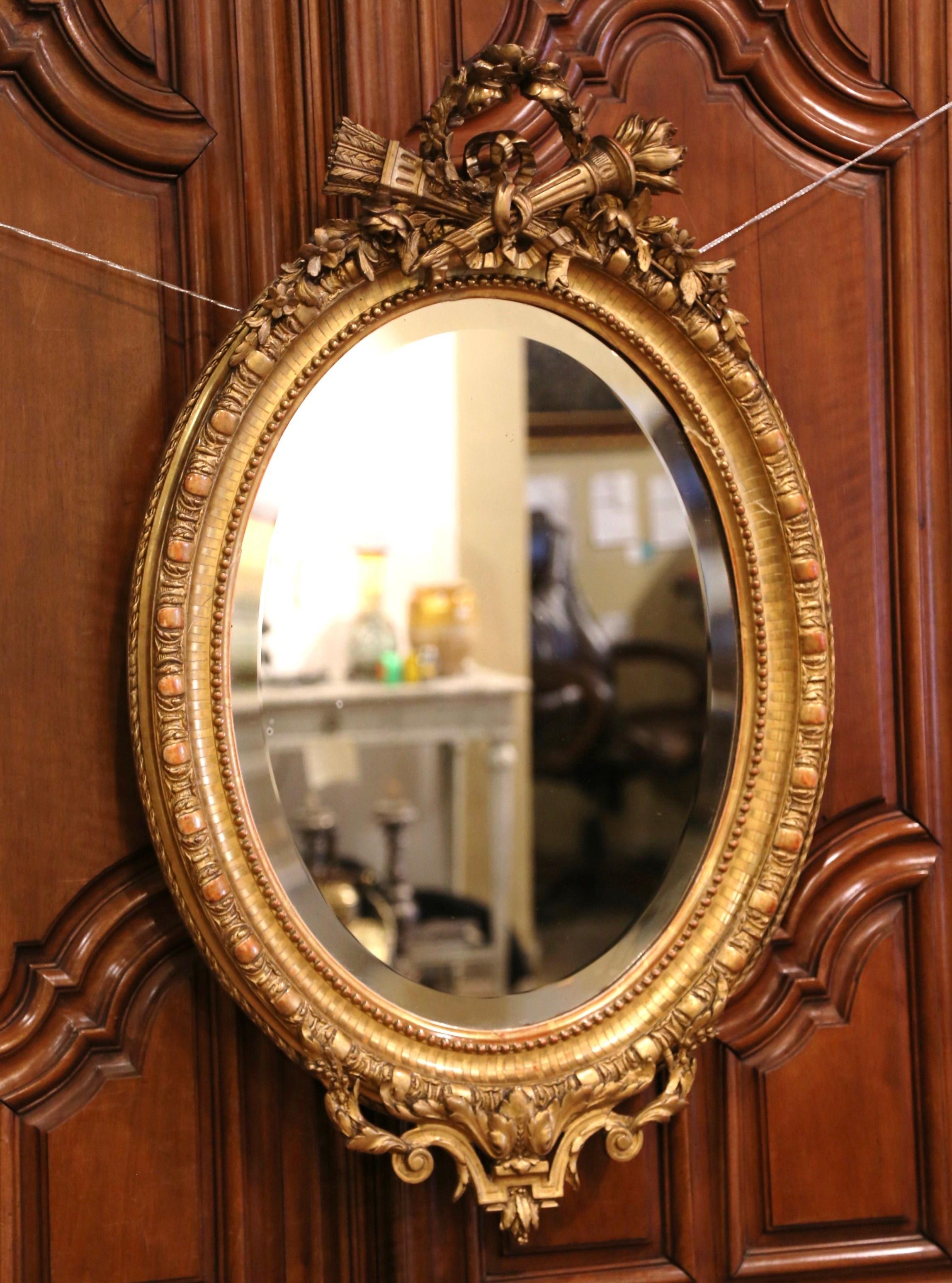 19th Century French Louis XVI Carved Giltwood Oval Wall Mirror with Torch Motif 3
