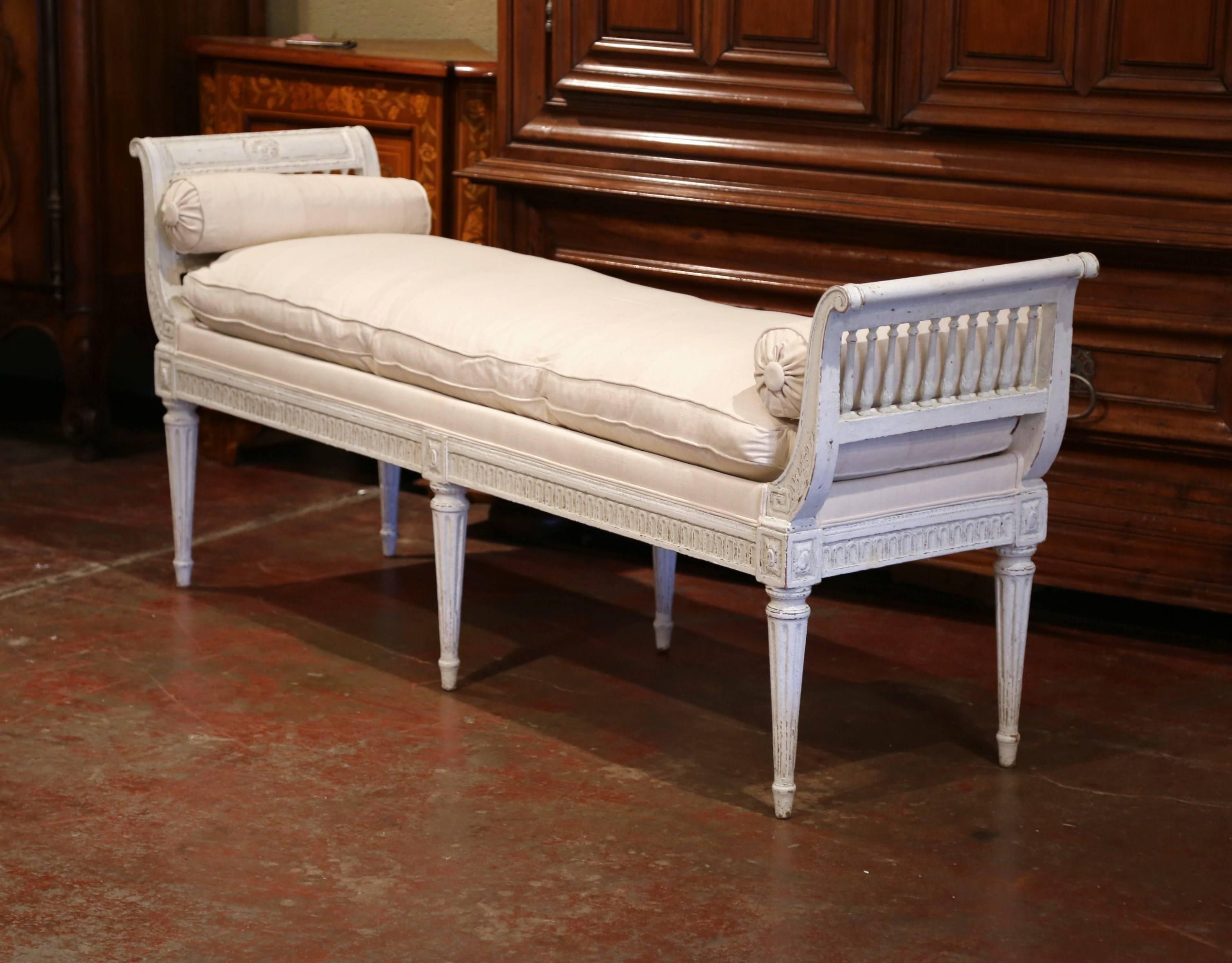 Place this elegant antique six-leg bench at the foot of a king-size bed or in your living room for extra, versatile seating. Crafted in France, circa 1880, the traditional banquette features a curved back with spinals, detailed carvings around the