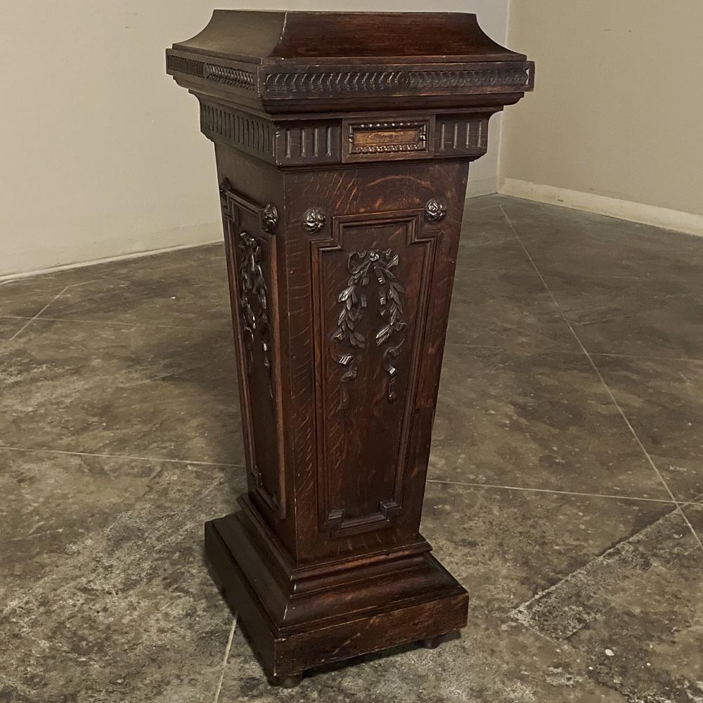 19th Century French Louis XVI carved pedestal is the most exquisite way to display your prized sculpture, vase or objet d'art! Hand-crafted exclusively from old-growth quarter-sawn oak, it features an architecture inspired by the classic Greeks and